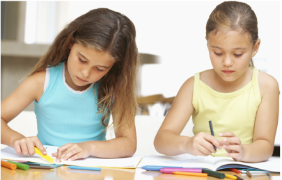 Two young girls enjoying an activity in a library. 